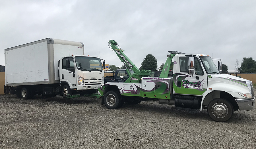 Brown's Automotive & Towing, white tow truck, wheel lifting white delivery truck - Edwardsville, IL